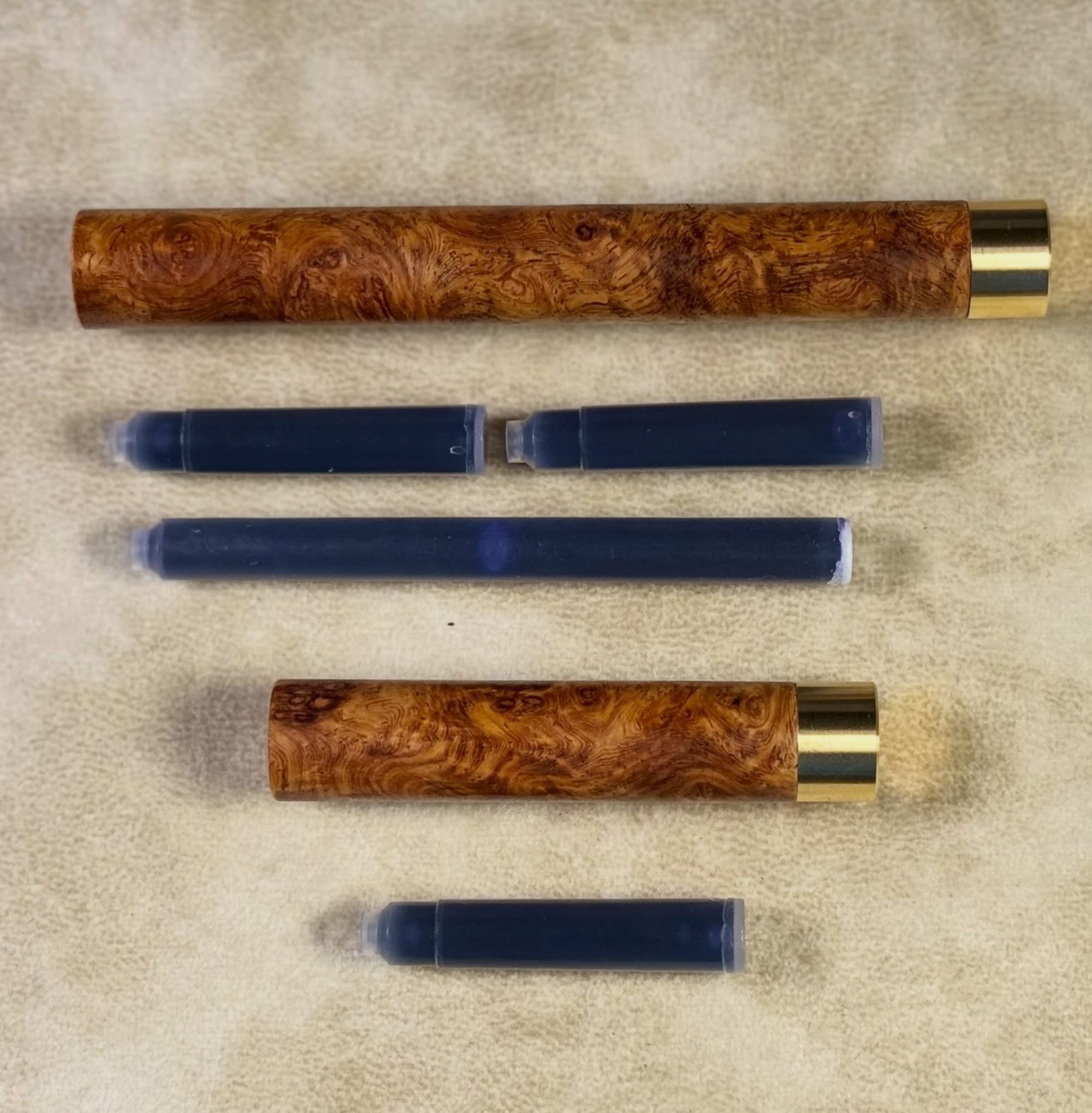 Craft A wooden refill cases open with ink cartridges.