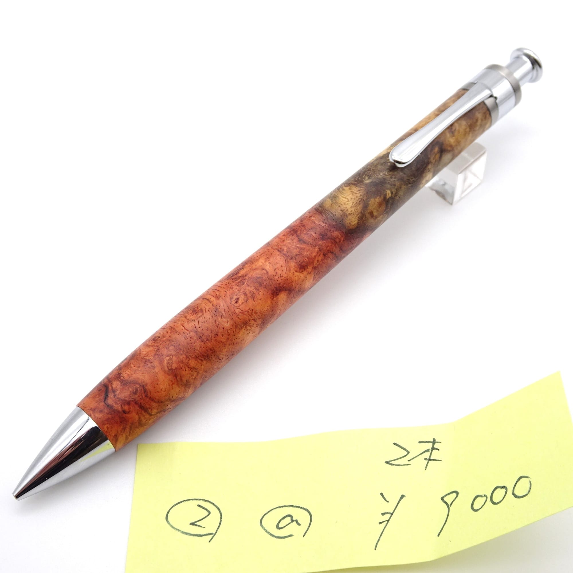 Setsu karin burl, red-and-white figure mechanical pencil, lot 2, photographed with the maker’s numbered price note.