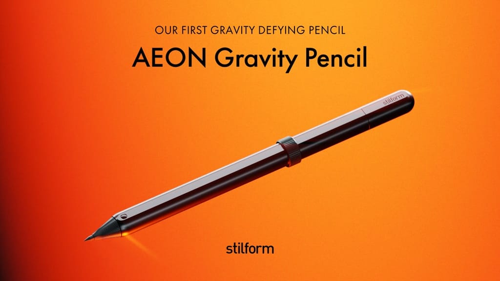 Stilform AEON Gravity pencil shown diagonally against orange campaign artwork